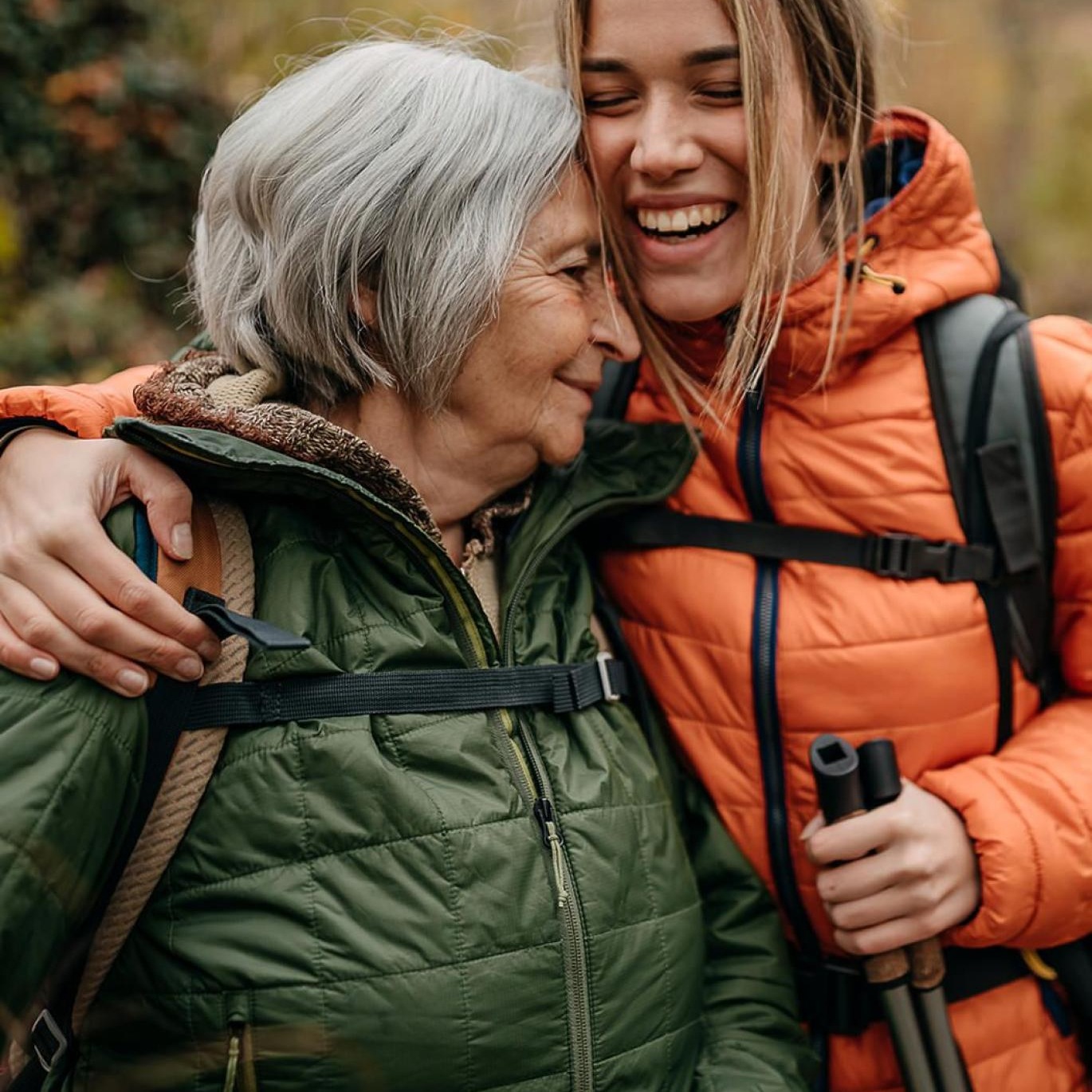 a couple of women smiling while hiking